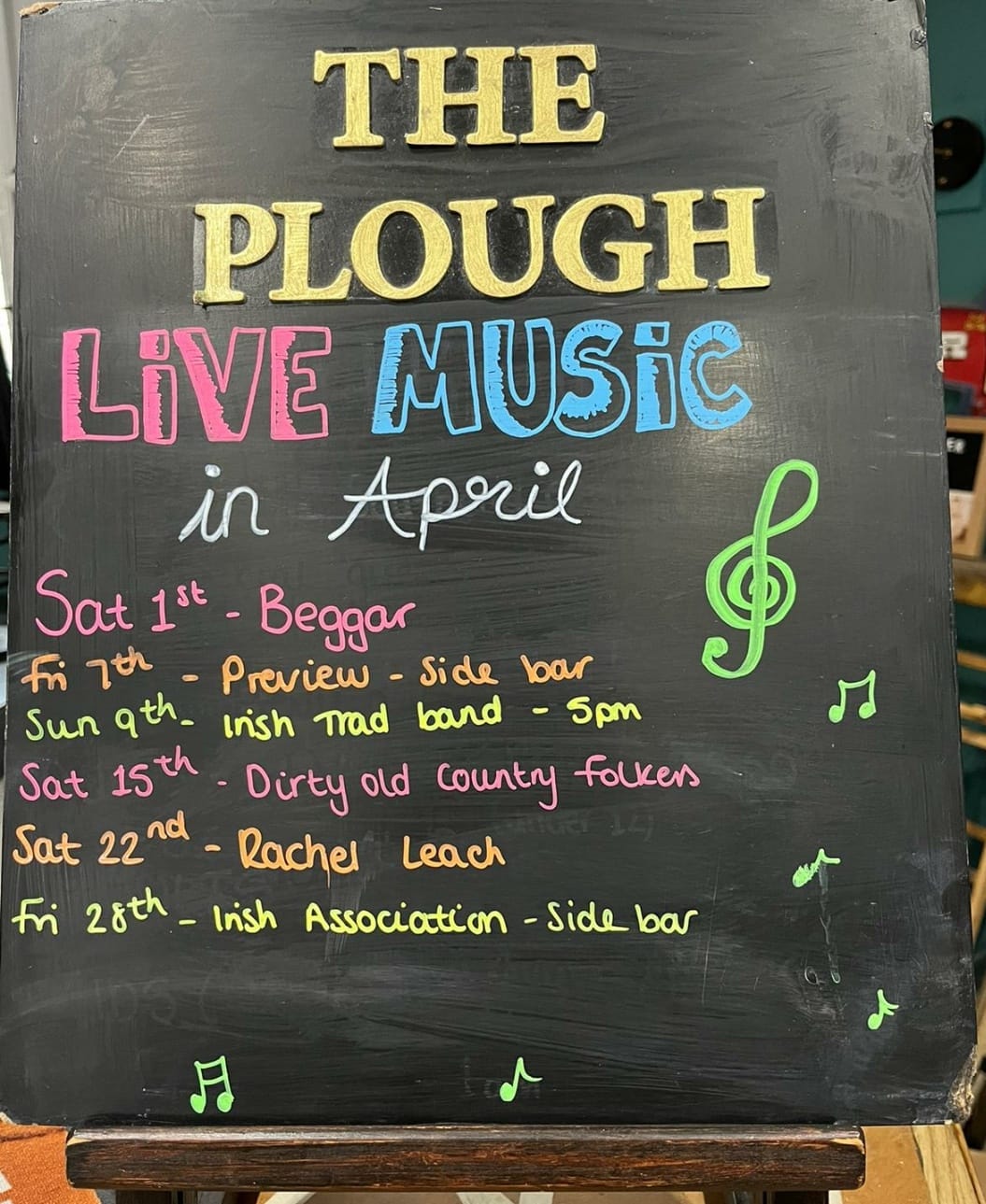 Chalkboard listing live music at The Plough